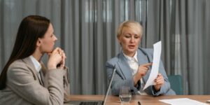personal brand coaches with client at an office